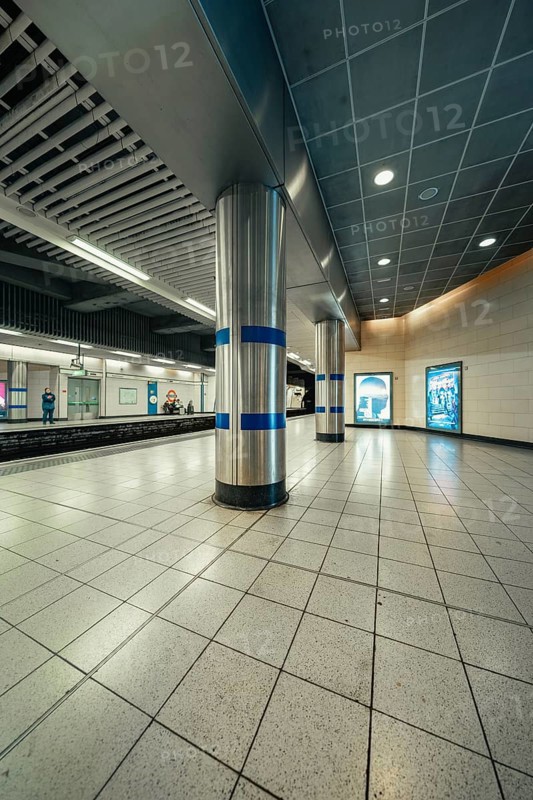 Lonely subway station with tiled floors and modern columns in a cool atmosphere, London, United Kingdom, World