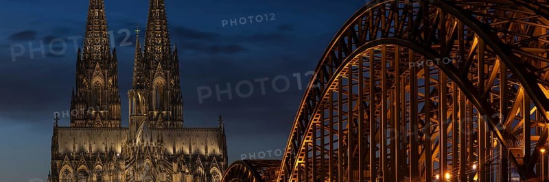 Evening atmosphere, Cologne Cathedral illuminated with LED lamps and the Hohenzollern Bridge, Cologne, North Rhine-Westphalia, Germany
