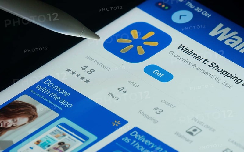 Dhaka, Bangladesh- 30 Oct 2025: Walmart app on a iPad screen with a pen pointing at the install option