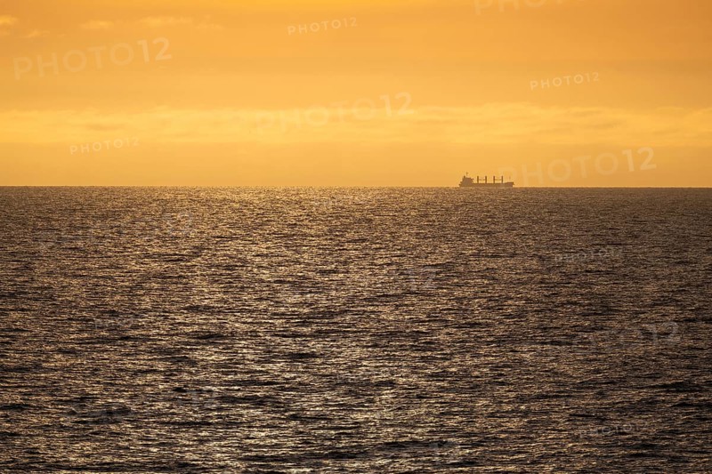 Silhouette, cargo ship, evening light, Baltic Sea