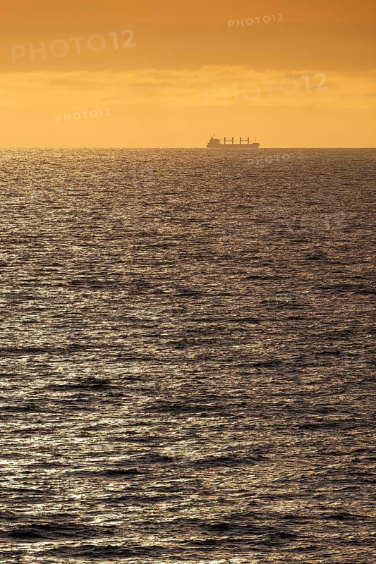 Silhouette, cargo ship, evening light, Baltic Sea