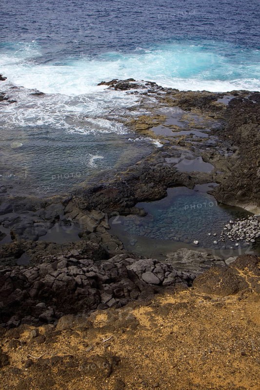 Coastal scene with rocks and waves hitting the cliffs. Dynamic natural scenery, Yaiza Lanzarote