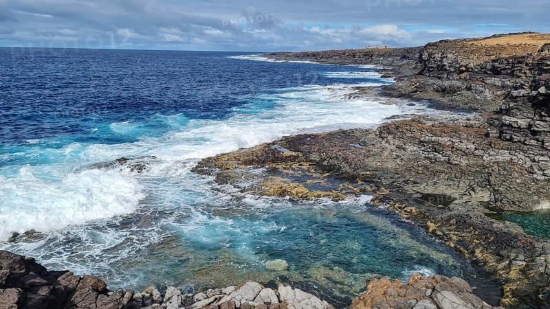 Rugged coastal area with thundering waves, rugged rocks and sweeping views over the sea, Yaiza Lanzarote