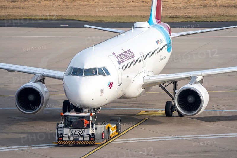 Eurowings Airbus is pushed from the gate onto the taxiway, ready to go, to Cologne/Bonn Airport, CGN, North Rhine-Westphalia, Germany