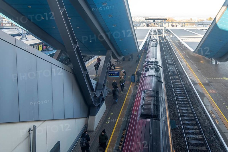 Modern architecture looking down on Class 220 Voyager diesel-electric multiple unit train, Reading railway station, Berkshire, England, UK
