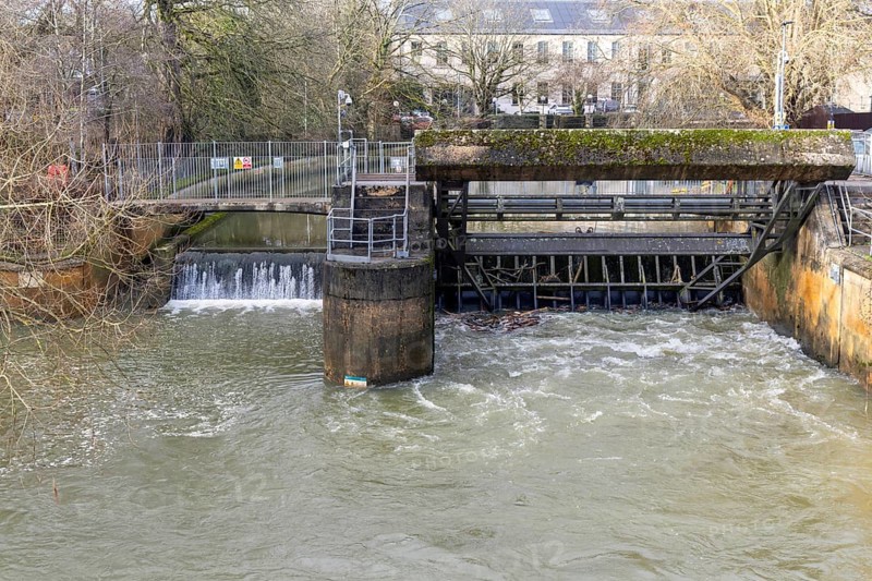 River Sluice Gate flood defence system in operation on River Avon, Chippenham, Wiltshire, England, UK