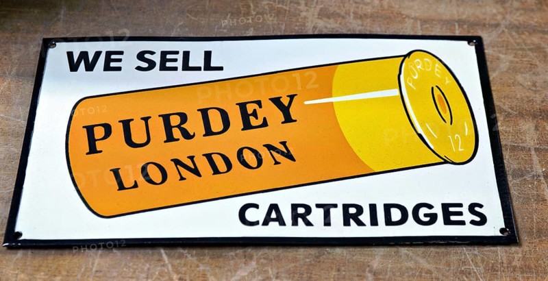 Enamel vintage reproduction advertising sign for Purdey London shotgun cartridges, UK