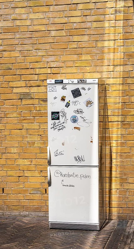 Old refrigerator is on a backyard, Potsdam, Brandenburg, Germany