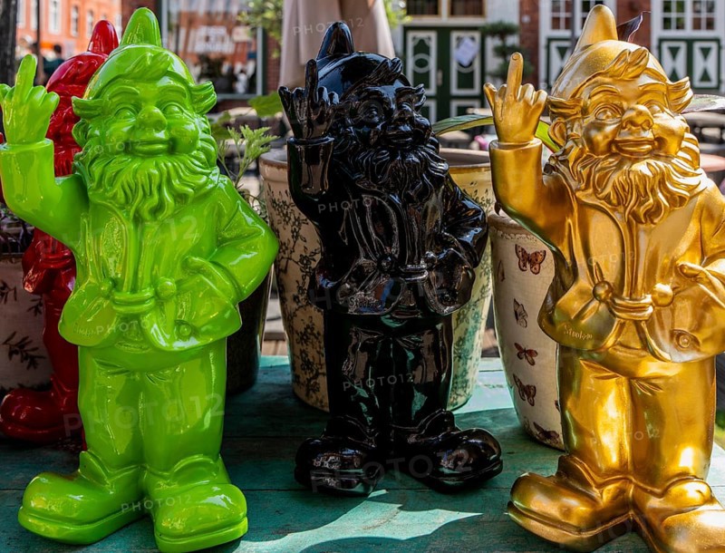Colored garden gnomes, decoration in front of a shop in downtown Potsdam, Brandenburg, Germany