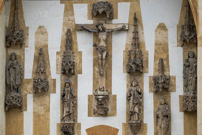 Christ sculpture and remains of the former monastery church of S. Johannes Baptistam above portal of the monastery church, Blaubeuren Abbey, Swabian Alb, Baden-Württemberg, Germany
