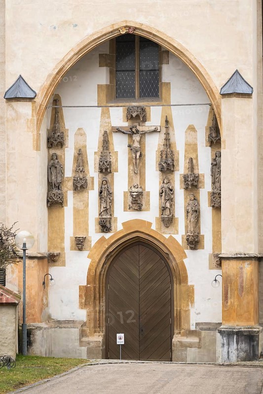 Christ sculpture and remains of the former monastery church of S. Johannes Baptistam above portal of the monastery church, Blaubeuren Abbey, Swabian Alb, Baden-Württemberg, Germany