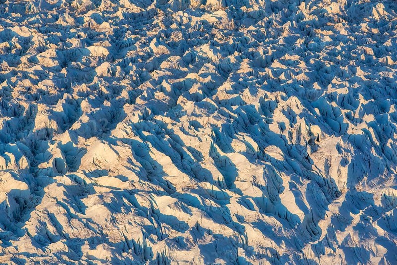 Aerial view of Ice sheet in Greenland, Arctic landscape, frozen wilderness, glaciers and snow-covered terrain, Climate change, Global warming, Greenland, North America