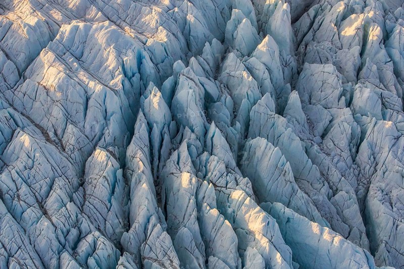 Aerial view of Ice sheet in Greenland, Arctic landscape, frozen wilderness, glaciers and snow-covered terrain, Climate change, Global warming, Greenland, North America