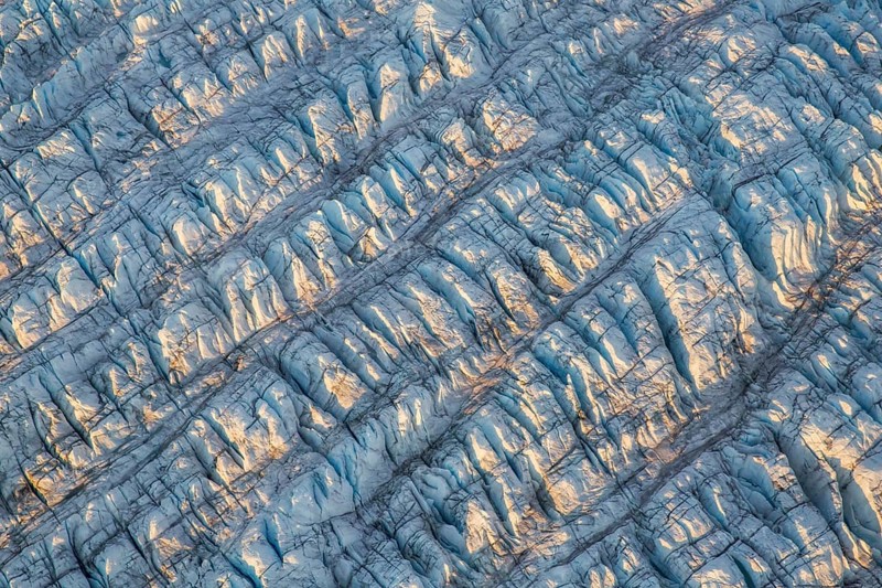 Aerial view of Ice sheet in Greenland, Arctic landscape, frozen wilderness, glaciers and snow-covered terrain, Climate change, Global warming, Greenland, North America