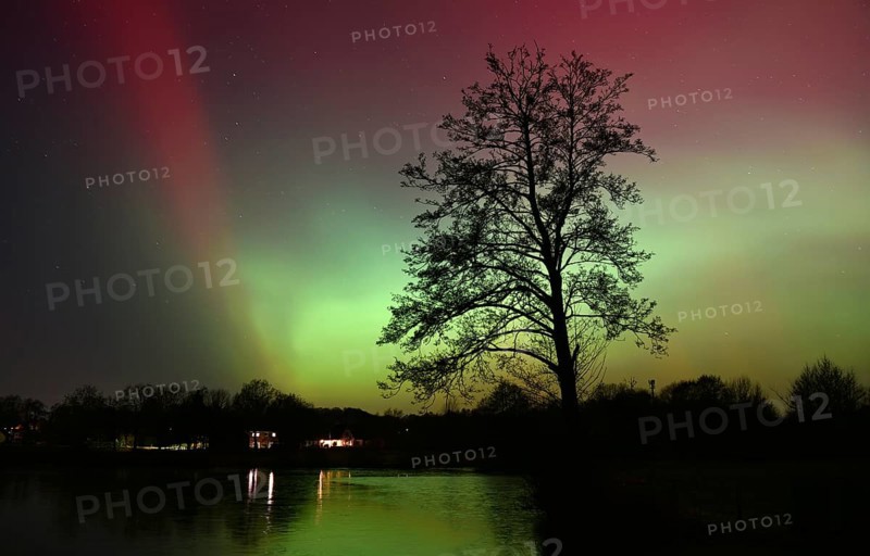 Northern lights, northern lights, on a lake in Schleswig-Holstein, Germany