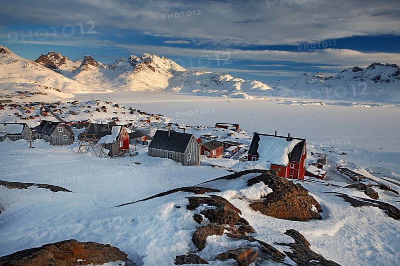 Sunrise at Tasiilaq (Angmagsalik in Inuit) a small village located on Ammassalik Island in the Irminger Sea, within the Sermersooq municipality, eastern Greenland, North America