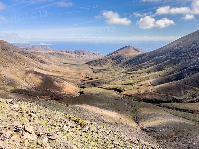 Valle de la Higuera valley with views of Playa Quemada, Ajaches Mountains, Femés, Lanzarote, Canary Islands, Spain