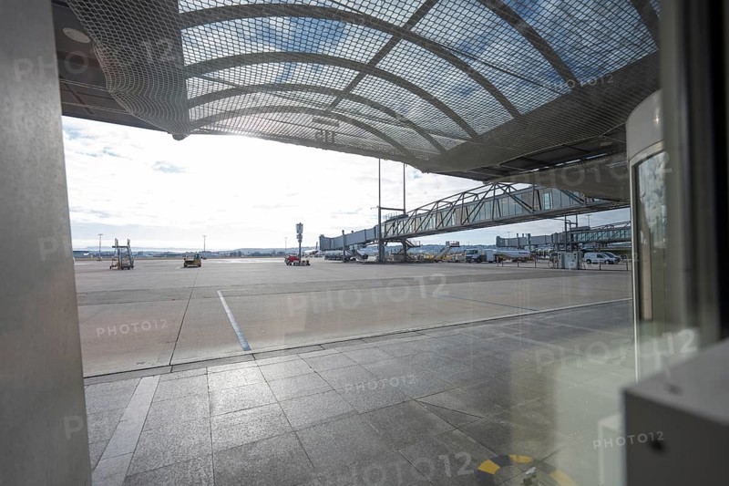 Extensive airport apron in bright sunlight, covered with a grid structure, Stuttgart Airport, Germany