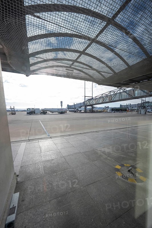 Apron covered by a grid construction with far-reaching views and sunlight, Stuttgart Airport, Germany