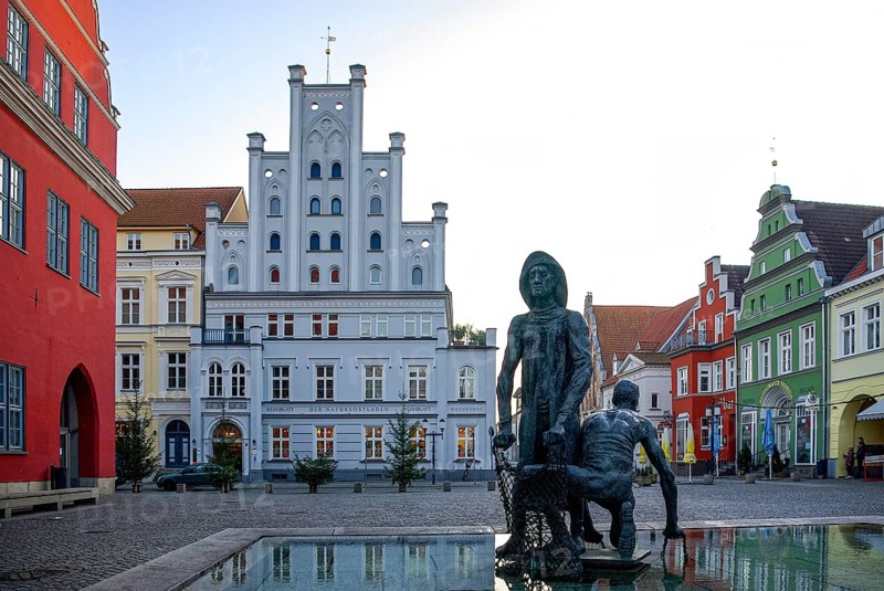 Fishing fountain with sculptures by Jo Jastram at the fish market in the Hanseatic city of Greifswald, Mecklenburg-Western Pomerania, Germany, for editorial use only