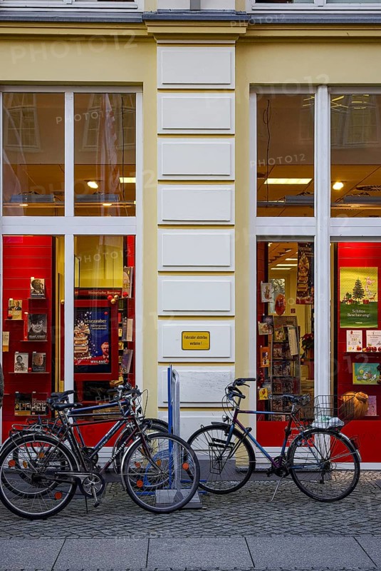 Bicycles parked in front of the Weiland bookstore at the fish market in the Hanseatic City of Greifswald, Mecklenburg-Western Pomerania, Germany, for editorial use only