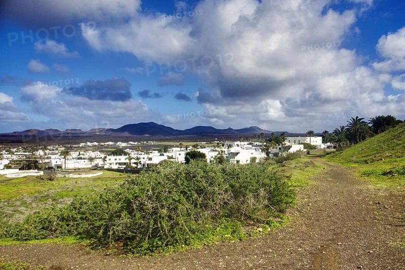 Path to the municipality of Yaiza at the foot of green hills, Yaiza Lanzarote