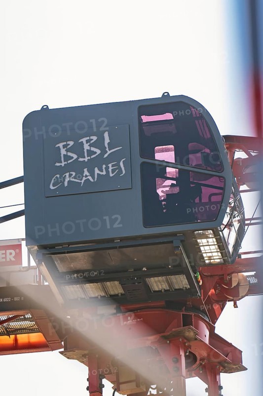 Close-up of a crane operator cabin with lettering in the construction zone, carpentry, new building, Stuttgart, Germany