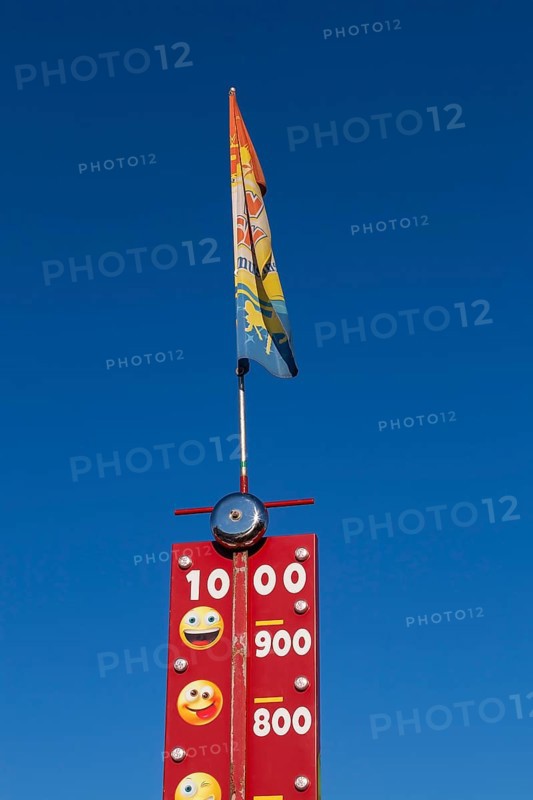 Close-up of High Striker game of strength with numbered score levels at Fun Show traveling amusement ride park, Old Port of Montreal, Quebec, Canada