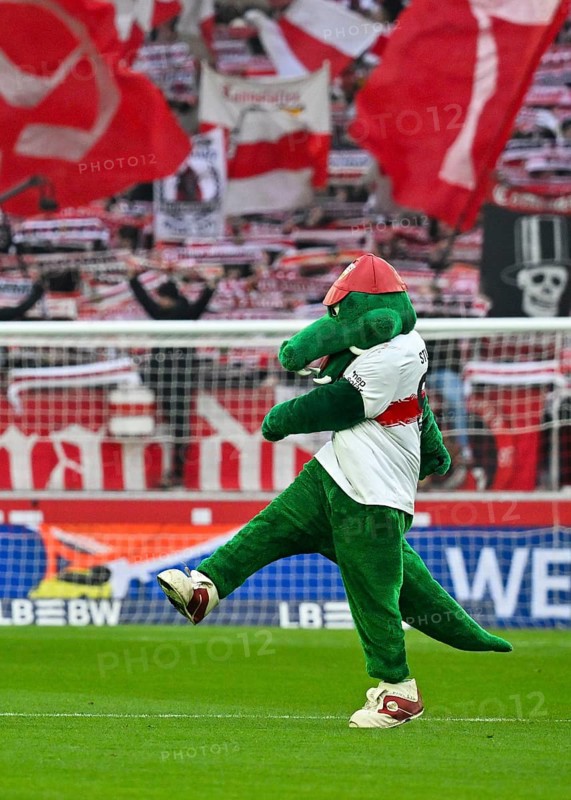 Mascot Fritzle VfB Stuttgart kicks in front of fan block, fans, fan curve, flags, atmosphere, atmospheric Cannstatt curve VfB Stuttgart, MHPArena, MHP Arena Stuttgart, Baden-Württemberg, Germany