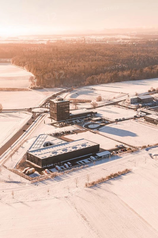 Snow-covered industrial area surrounded by extensive fields in wintry weather, Nagold, Calw district, Black Forest, Germany