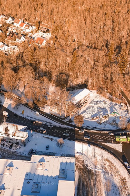 Snowy road junction on the edge of a forest with adjacent buildings, Nagold, Calw district, Black Forest, Germany