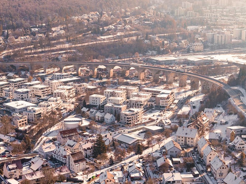 Snowy town with an impressive viaduct in a hilly landscape, Nagold, Calw district, Black Forest, Germany