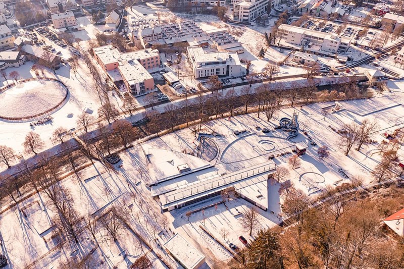 Aerial view of a snowy park with buildings and trees, Nagold, Calw district, Black Forest, Germany