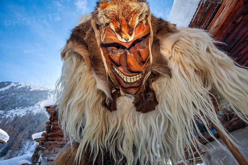 Portrait of traditional hand-carved wooden mask from the Loetschental Carnival, representing folkloric characters, spirits, and demons, Loetschental village, Valais Canton, Switzerland