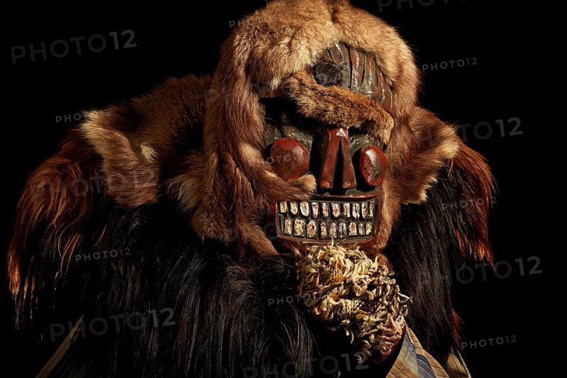 Portrait of traditional hand-carved wooden mask from the Loetschental Carnival, representing folkloric characters, spirits, and demons, Loetschental village, Valais Canton, Switzerland