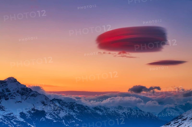 Lenticular clouds over Zermatt at sunset in winter, Valais, Switzerland