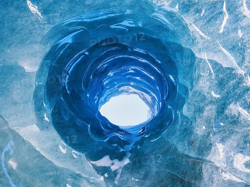 Hole in an ice cave, formed by melting and subglacial streams, Climate Change, Global Warming, Vadret da Morteratsch, Grisons Canton, Switzerland