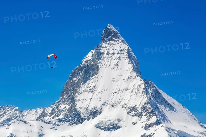Winter paragliding near the Matterhorn, Zermatt, Valais, Switzerland