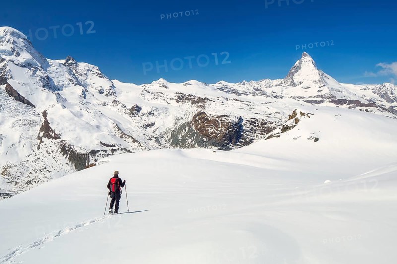 Snowshoeing in the Gornergrat region with views of the surrounding mountains and the Matterhorn, Zermatt, Valais Canton, Switzerland