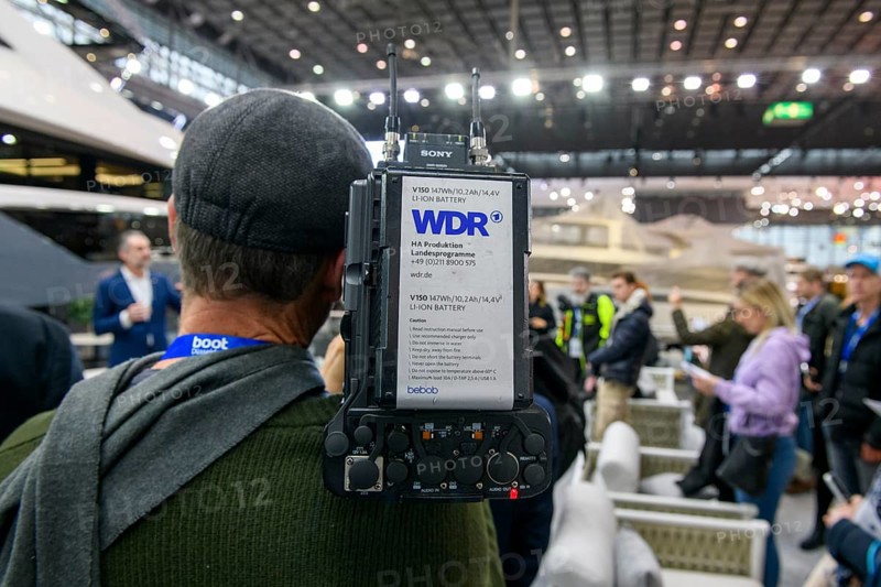 Press photo Cameraman from Westdeutscher Rundfunk WDR producing coverage by Messe Boot, Düsseldorf, North Rhine-Westphalia, Germany