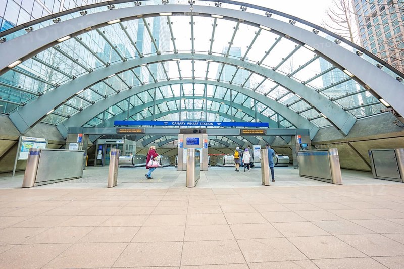 A modern building entrance with a glass roof and deserted escalators, London, England, Great Britain