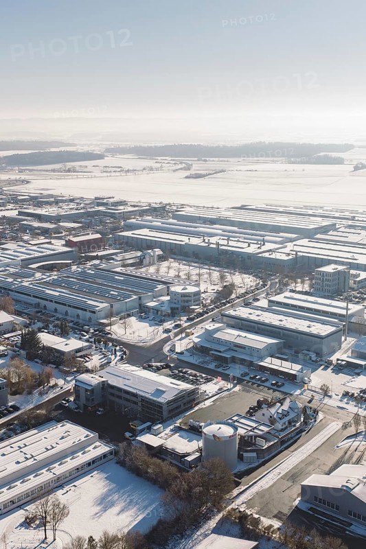 Snowy industrial area in Europe with numerous buildings and clear skies, Wolfsberg industrial area, Nagold, Germany