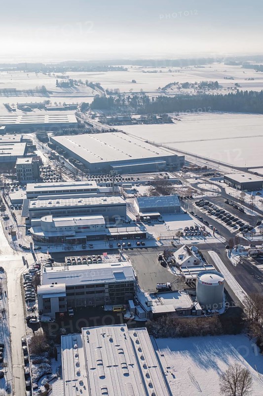 Industrial complex in a snowy landscape with clear skies, Wolfsberg industrial area, Nagold, Germany