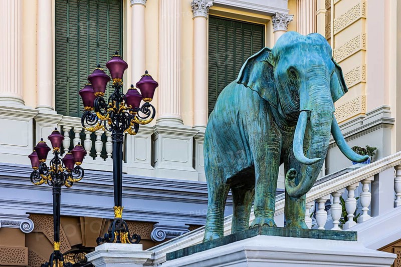 The Grand Royal Palace, an elephant statue and multi-armed lanterns decorate the side entrance of the Chakri Maha Prasad throne hall, Phra Nakhon, Bangkok, Thailand's metropolis, Thailand