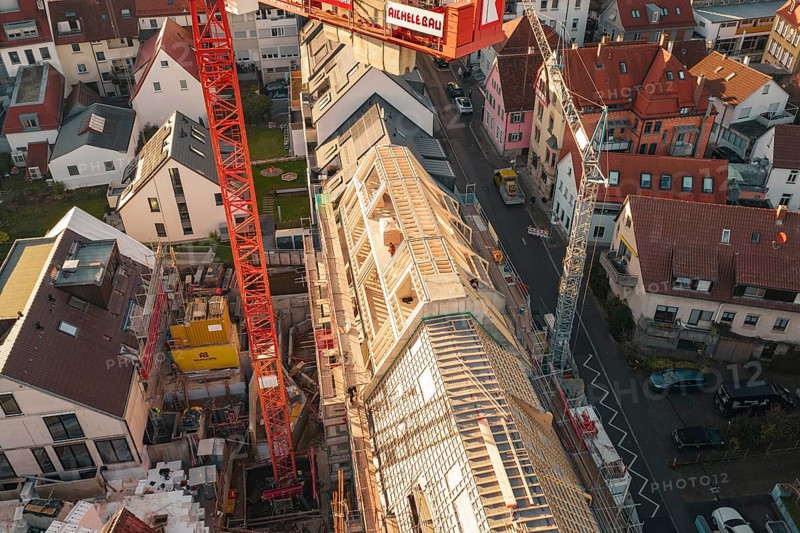 Upper perspective of a construction site in a residential area with visible roof structures, carpentry, renovation, roof extension, Stuttgart, Germany