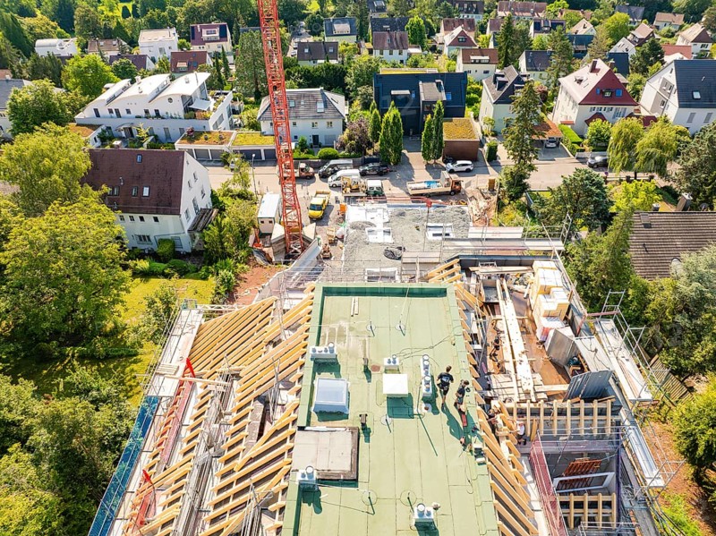 View from above of a building under construction with a view of an urban scene, carpentry construction, roof extension, renovation, Stuttgart, Germany
