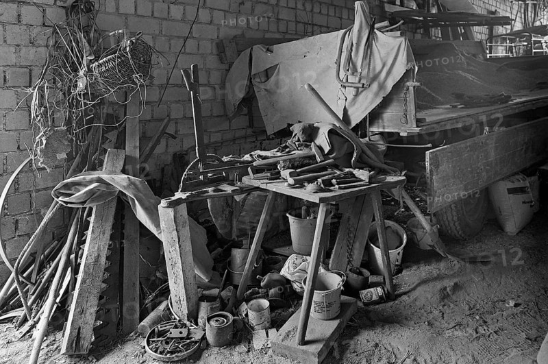Tool shed with tool bench on a former Franconian farm, black and white, Franconia, Bavaria, Germany