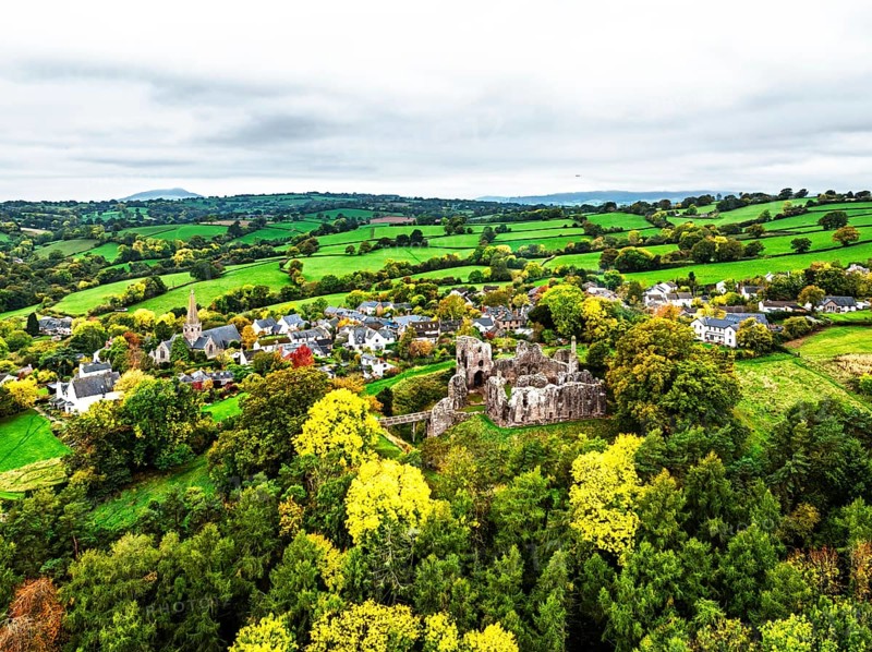 Autumn Colours over ruins of Grosmont Castle from a drone, Grosmont, Monmouthshire, Wales, UK