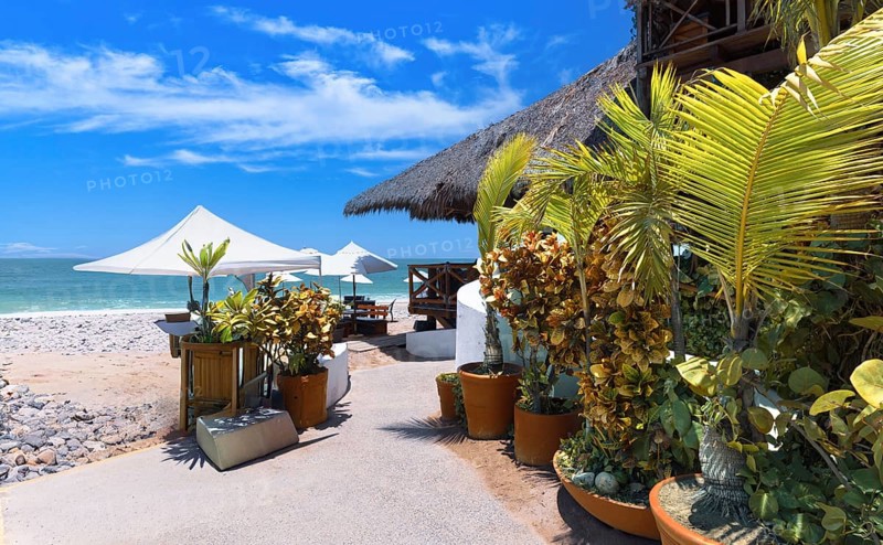 Restaurants and cafes with ocean views on Playa De Los Muertos beach and pier near famous Puerto Vallarta Malecon, the city largest public beach