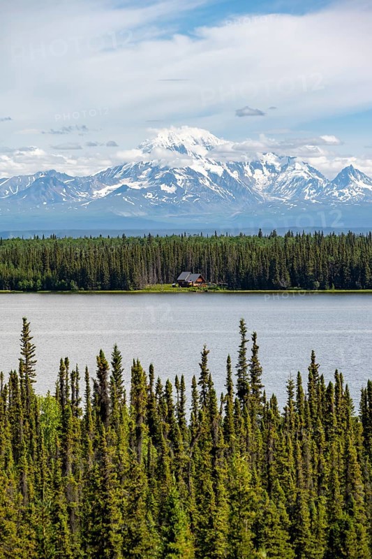 House on Lake Willow Lake, Taiga landscape with high glaciated mountain peak Mount Drum, Wrangell Mountains, Alaska, USA